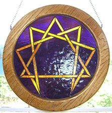 Stained Glass Enneagram - red-orange lines on cobalt blue background